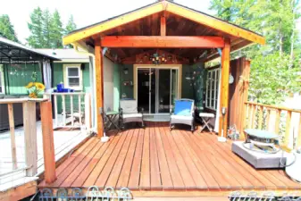 Step out from the master bedroom onto this charming covered deck, perfect for enjoying your morning coffee or evening relaxation.