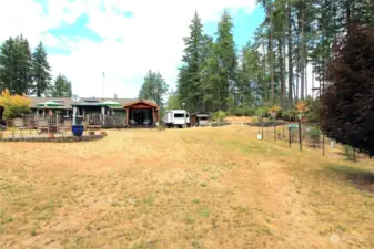 This property features a designated space for RV parking with 30-amp service, providing convenience for outdoor enthusiasts.  With easy access and plenty of room, it's perfect for storing a recreational vehicle when not in use.