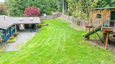 Partial back yard view, fully fenced yard