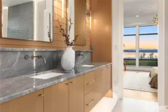 Luxurious Primary Bath With Slab Counters, Custom Rift Oak FloatingCabinets and Wall Detail