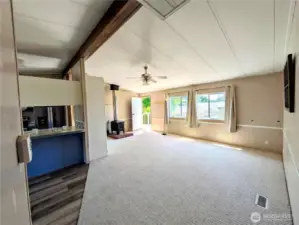 Large living room with wood stove.
