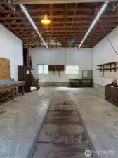 Shop has grease pit, It's own office, wired to handle your biggest machines!
