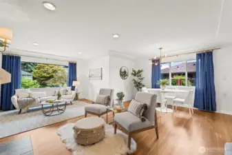 Large windows brighten the space with natural light, enhancing its open feel.
