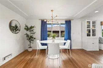 The living space flows seamlessly into the dining area, perfect for entertaining.