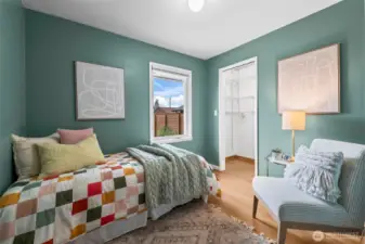 The third bedroom offers a peaceful backyard view through its rear-facing window.