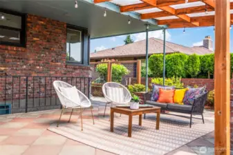 Enjoy a secluded backyard with a spacious covered patio and beautifully crafted custom fencing (installed in 2020).