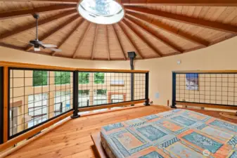 Up to the loft. You can actually stand up, and it's a perfect space for extra sleeping quarters, yoga, or perhaps a reading room.