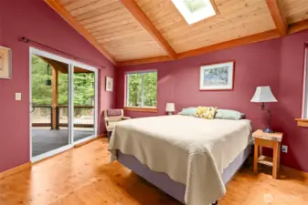 Guest bedroom  with access out to the deck.