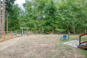 The backyard is fully fenced. Beyond the fence is 'Frog Hollow' pond and your 5 acres to explore.