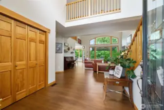 Soaring entry with beautiful flooring flowing throughout main living areas.