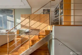 Look at these custom solid Walnut stairs and handmade railing in brushed nickel!