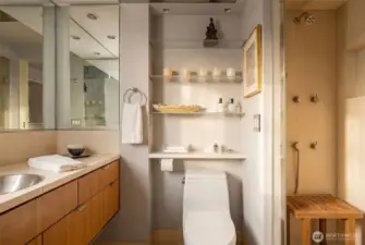 Primary bathroom features marble stone counters, heated floors, premium fixtures, stainless medicine cabinet and sink, and outlets inside the medicine cabinet and drawers.