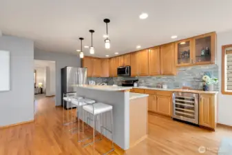 Kitchen features beverage cooler and bar area.