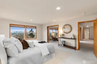 Primary suite offers fabulous views of downtown Renton, Lake WA & Seattle Skylne.