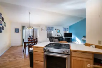 Tile counters and stainless appliances highlight the kitchen.