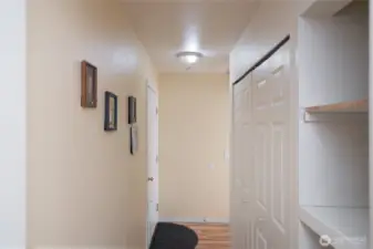 Hallway with washer and dryer hookups to right.