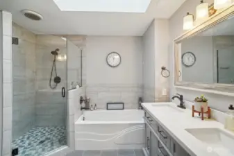 Primary remodeled spa like bathroom - lovely!! Beautiful tiled shower, double vanity and tub plus walk-in closets.