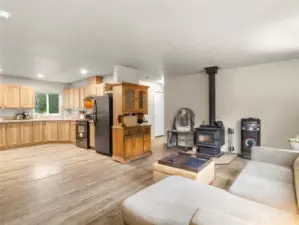 Cozy wood burning fireplace! Living room is completely open to kitchen and dining space.