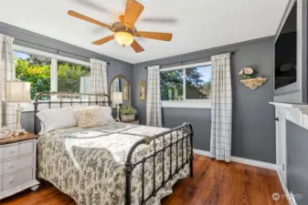 Bedroom #2, main floor -- we love the evergreens pouring in through every window!