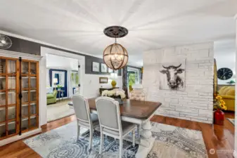 The decorator touches such as this unique chandelier make the rooms unique and warm. - Love this large dining room! - Plenty of room to stretch your table out for your entire group of guests!