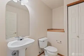 Just inside the front door and door between foyer and garage is the 1/2 bath.