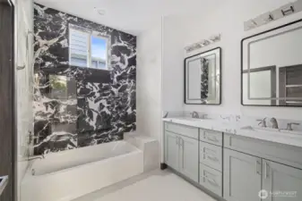 This full bath showcases the lay out and high finishes you can expect in the newly constructed home at 8608 42nd Ave S, Seattle, WA 98118, built by the same builder."