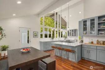 The sought-after daylight rambler floor plan is filled with natural light and boasts soaring ceilings, creating an open and airy ambiance throughout.