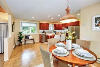 A large dining table can go by the half wall or a 4 top fits nicely by the slider