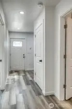 Hall leading to bedrooms, bathroom, and utility space.