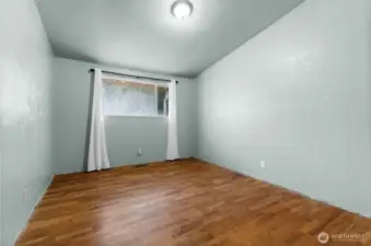 Bedroom #2 at the end of the hallway. Baseboard Trim was removed for carpet removal, and has since been re installed.