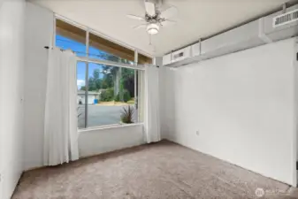 Access to the utility closet from this room. Tankless Instant Hot water heater!