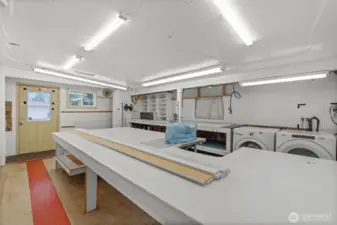Large workshop/craft room, also serving as the laundry room.