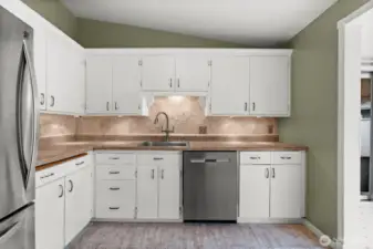Under cabinet lighting helps this kitchen shine.