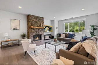 Anchored by dramatic floor-to-ceiling stone fireplace, the great room flows seamlessly from the gourmet kitchen providing a cozy and elegant gathering space.