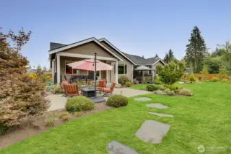 Covered and heated outdoor sitting area, plus adjacent fire pit table/seating offers a truly beautiful and tranquil retreat year-round.