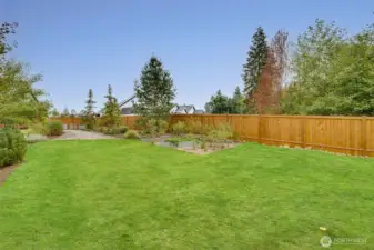Lush lawn and professional landscaping enhance the beauty of this immaculate, park-like 1+ acre oasis.