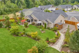 Lush lawn and professional landscaping enhance the beauty of this immaculate, park-like 1+ acre oasis.