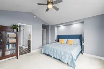 Vaulted Ceilings in the spacious Primary suite seamlessly flows into the ensuite spa-like bathroom.