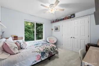 Secondary bedroom faces backyard.