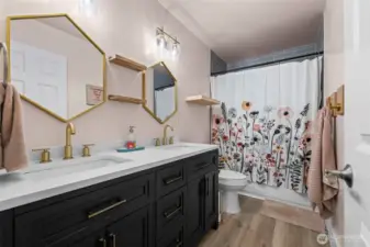 Updated bathroom upstairs has modern touches with everyday functionality.