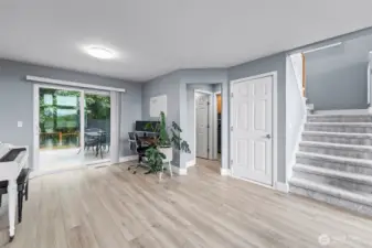 Additional space behind living room provides a versatile space. Closed door takes you down to the garage.