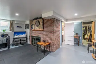 Lower-level 3rd bedroom features a fireplace and a half bathroom.