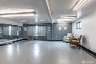 Large open space with windows and a heat source.