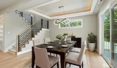 Spacious Dining Room that's steps from the covered deck. Virtually staged.
