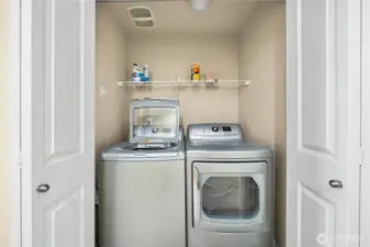 Laundry closet upstairs with bedrooms.
