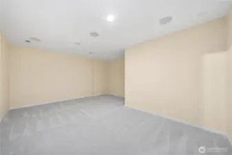 Lower level bonus room, originally set as home theater with surround sound wired in ceiling.