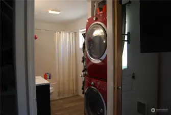 Primary master bathroom with stacked laundry hook-up.