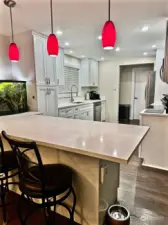 Completely new kitchen with cusytom cabinetry and stainless appliances that convey