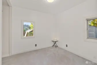 Bedroom with recent carpet and view of the back yard