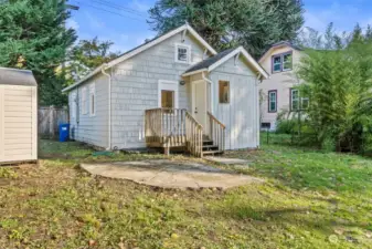 Rear of home. Storage shed and smaller storage box are included!